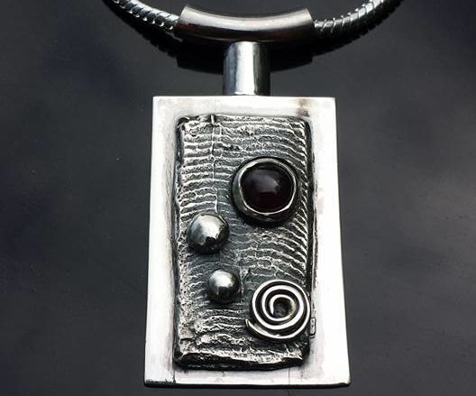 Silver Cuttlefish Cast w/ Garnet Pendant
