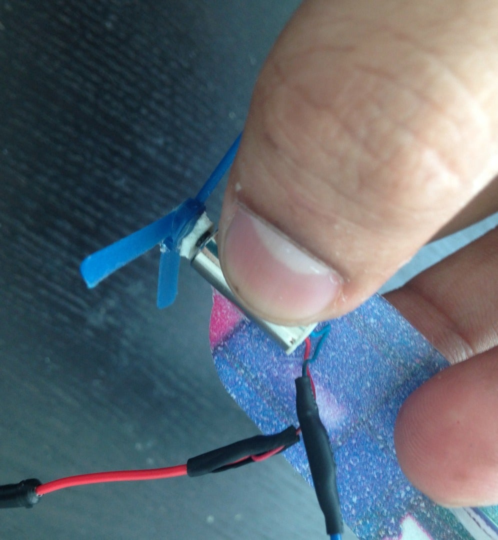 Hot Glue the Motor to the Gilder Body