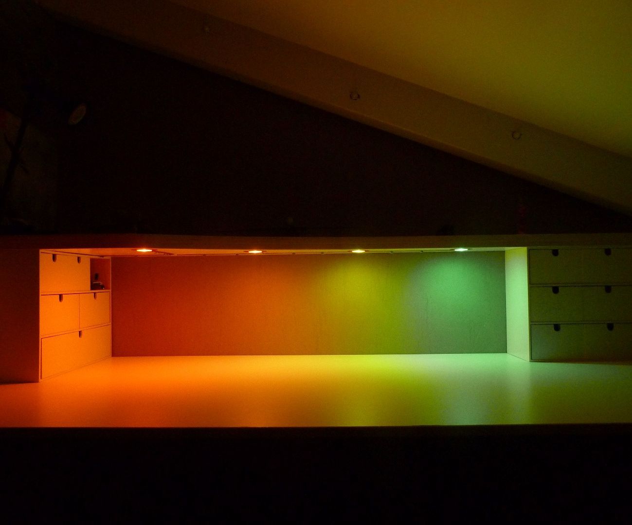 Raised desk shelf with multi coloured led