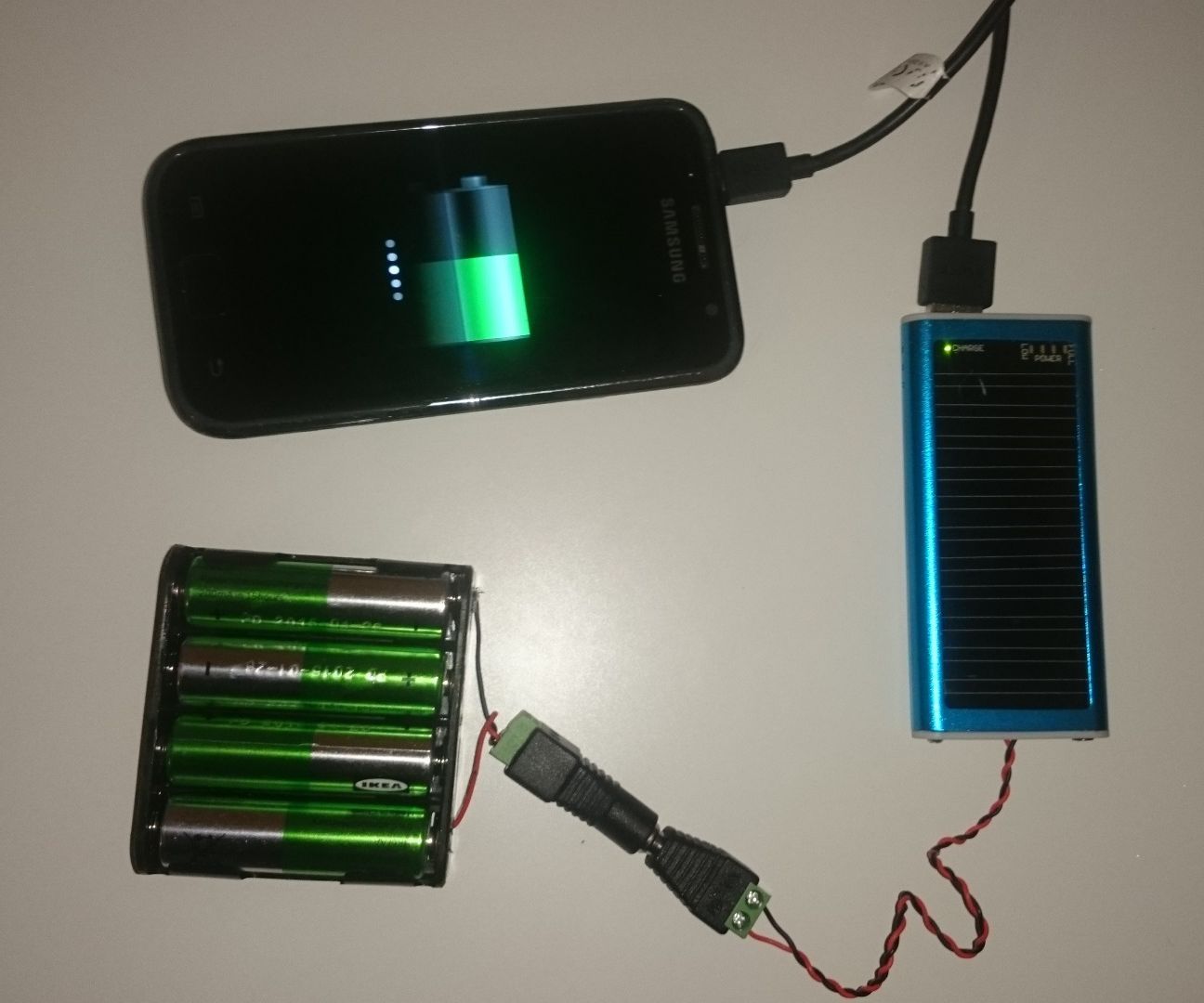 Old Solar Phone Charger to Charge From and the AA Batteries.