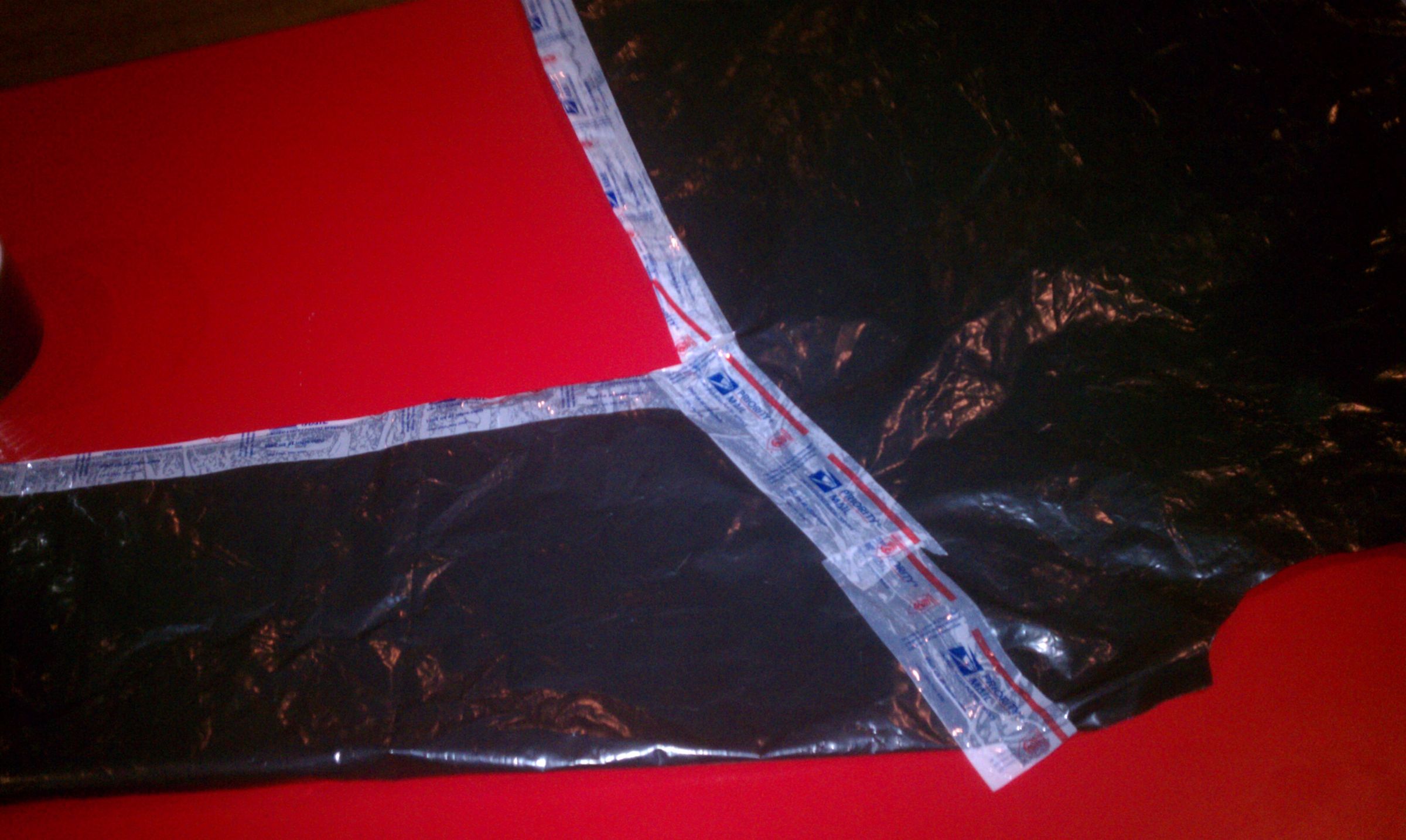 Quick Stylish Raincoat Out of Garbage Bag and USPS Tape 7