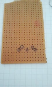 Enlarging the Holes of a Perfboard - Mac Gyver Style