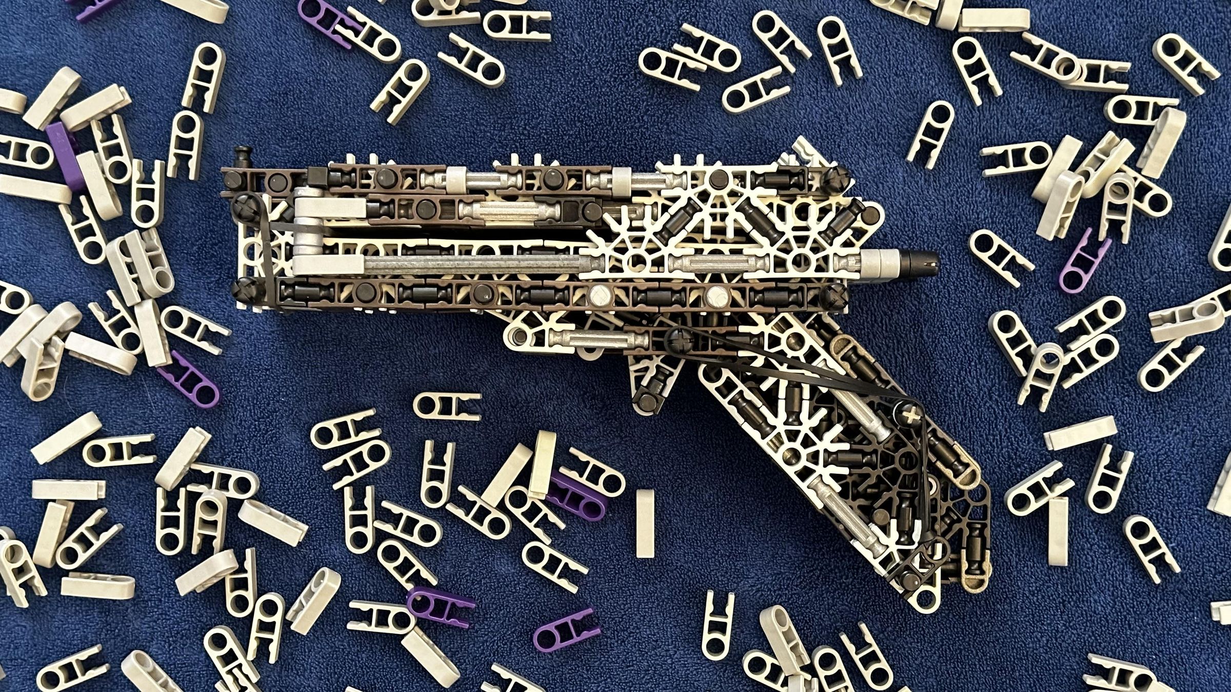 K'NEX Slide Action Repeating Slingshot Pistol - Instructables