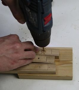 Make a Lamp Stand in the Form of a Wooden Tripod on Telescopic Legs.