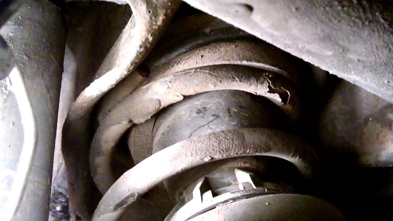 The dismantling of car suspension springs.