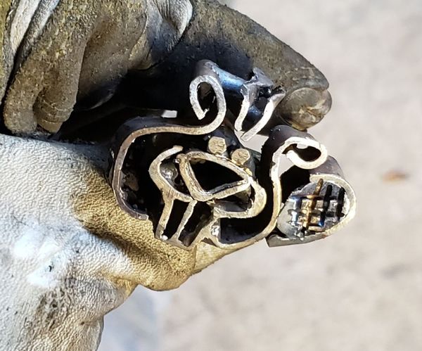 Tiny Branding Iron From a Cartoon