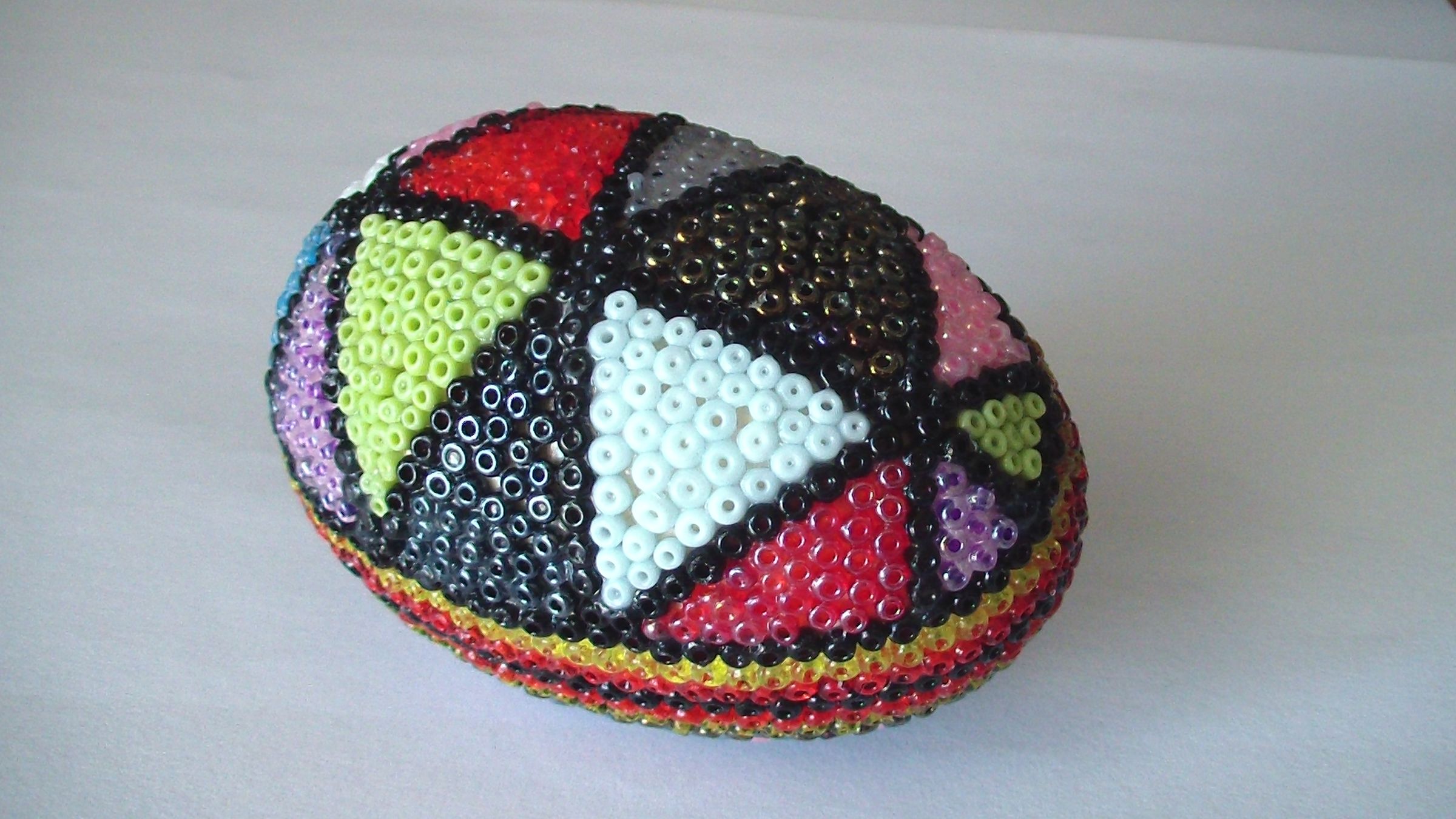 Wooden egg with beads