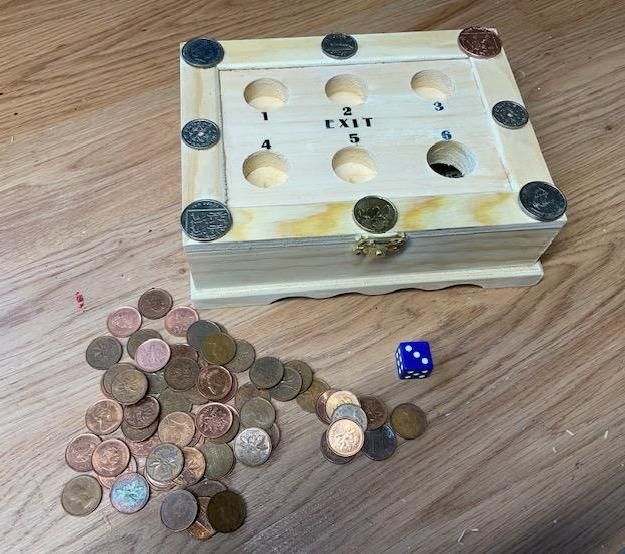 "EXIT"- COIN DROP GAME