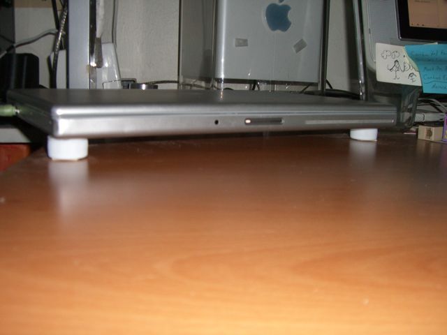 Laptop stand from 4 bottlecaps