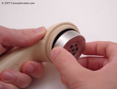 Unscrew the Speaker and Microphone Caps and Remove Innards