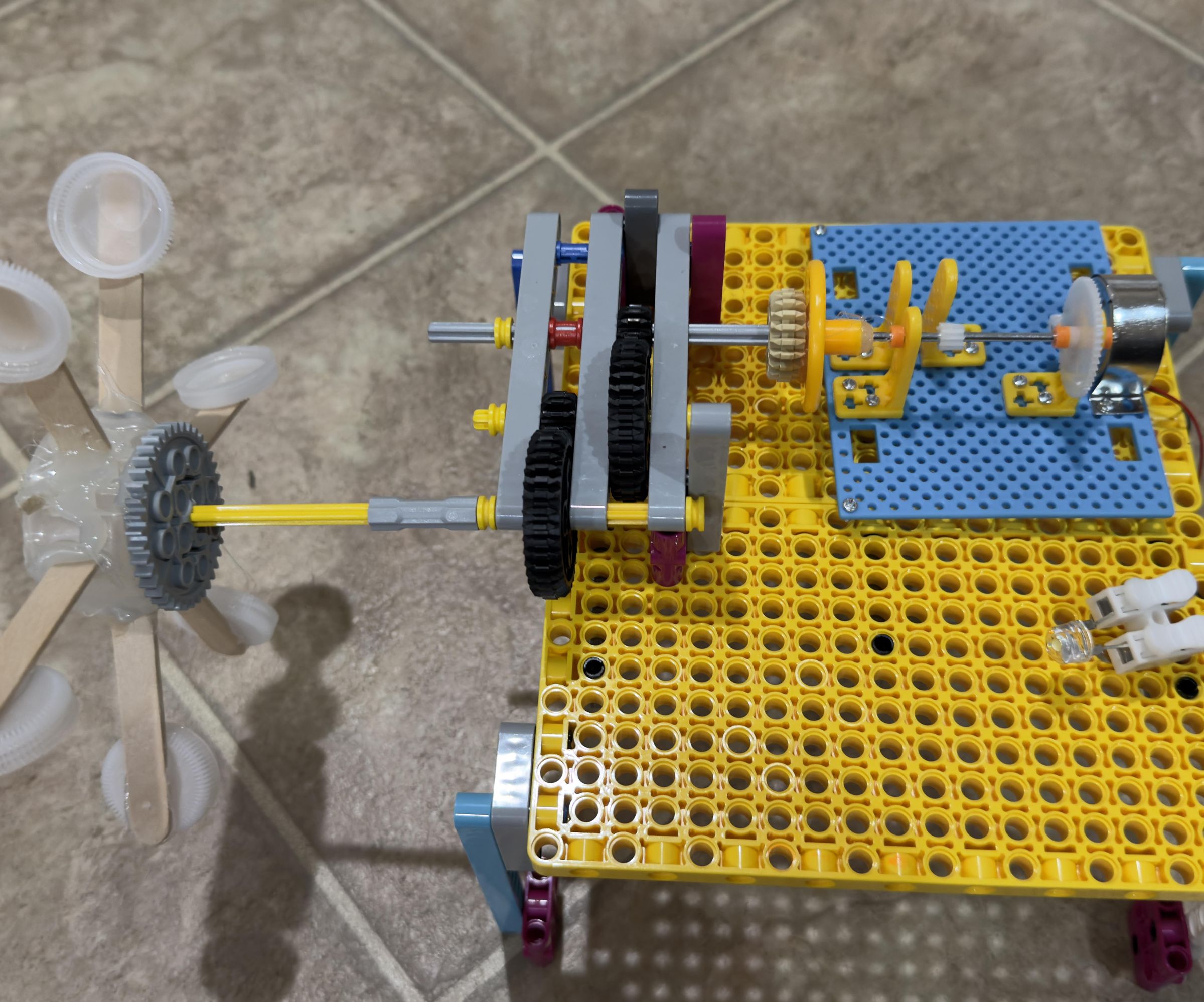 Utilizing Torque Multipliers in Waterwheels to Produce More Electricity Off of Waterfalls
