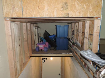 Storage Above Basement Garage Stairs.  Wasted Space Made Useful.
