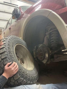 Place Your New Tire on the Studs of Your Car