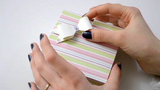 Stick the Paper Bow.