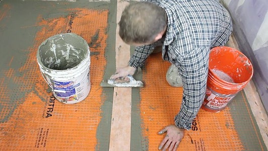 Firmly Press KERDI-BAND Into Thin-Set