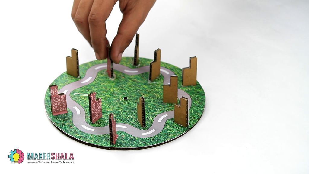 Take the Big Disc and Paste the Small Buildings on It at the Position. See Below for Reference.