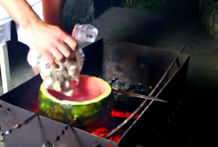 Cut Off the Top of a Watermelon, Remove Flesh, and Put Frozen Ravioli Inside the Watermelon.