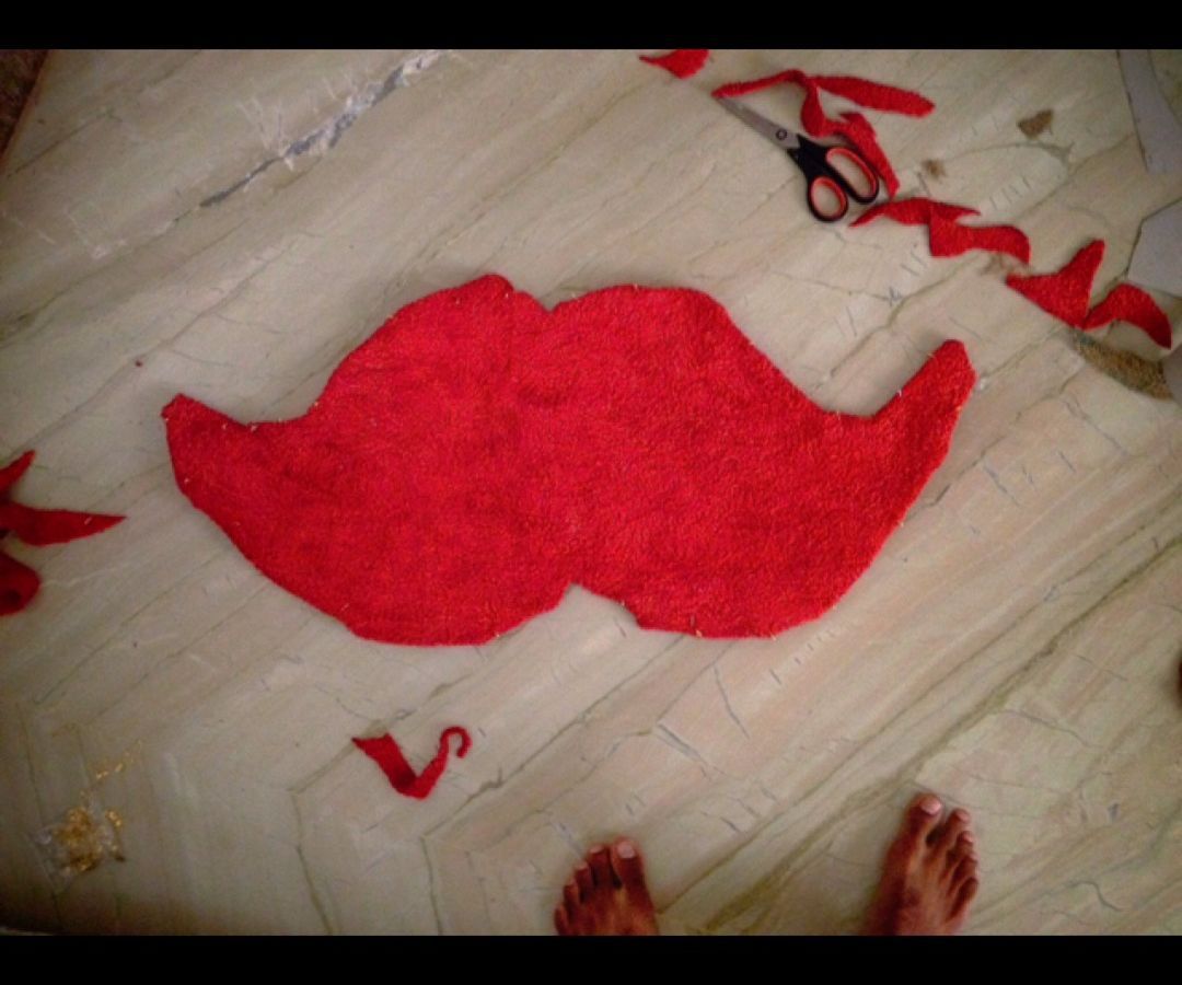 Old towel to a moustache floor mat