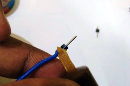 With the Help of Helping Hands Solder the Pin to Wire