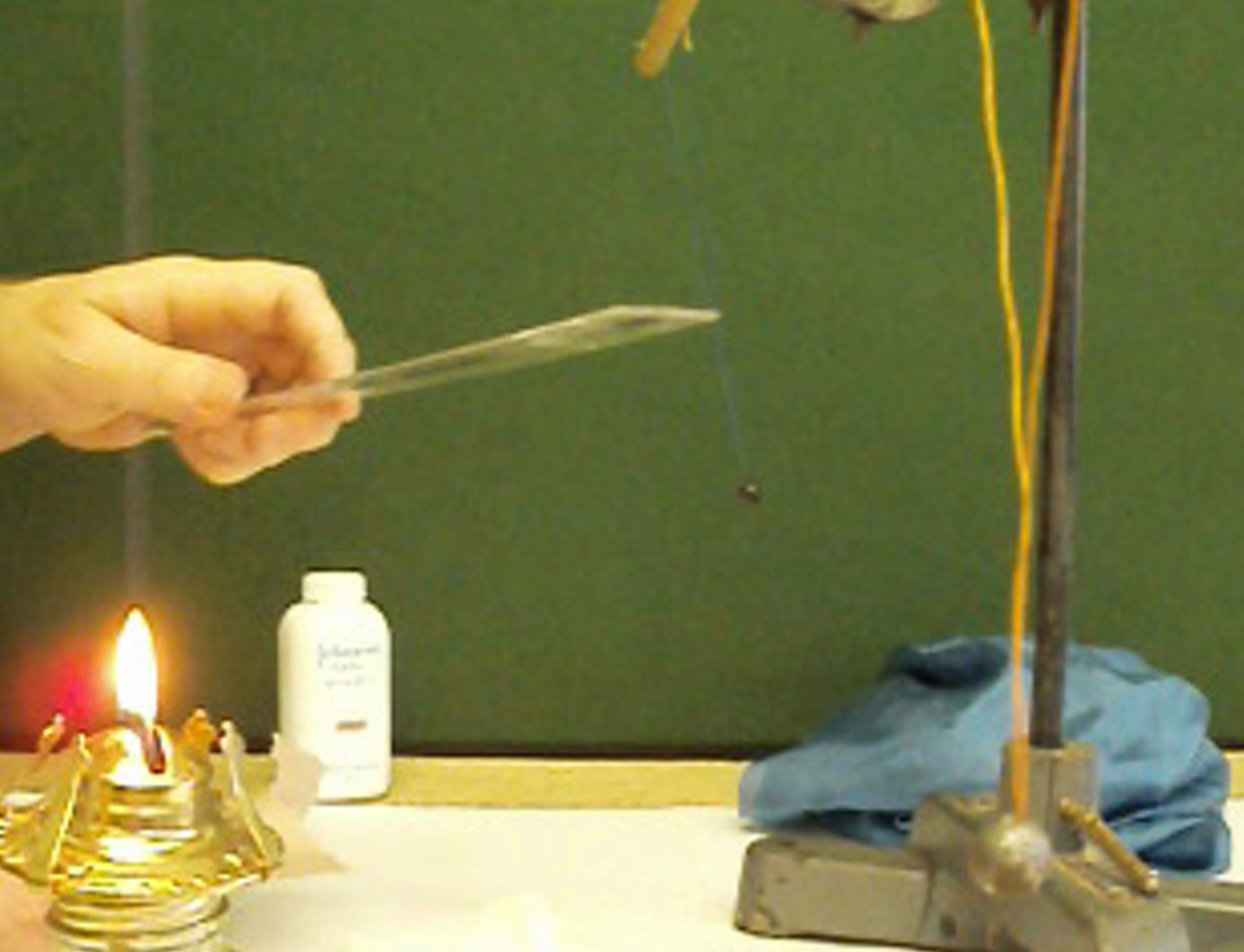 Discharging a Charged Ruler in a Flame