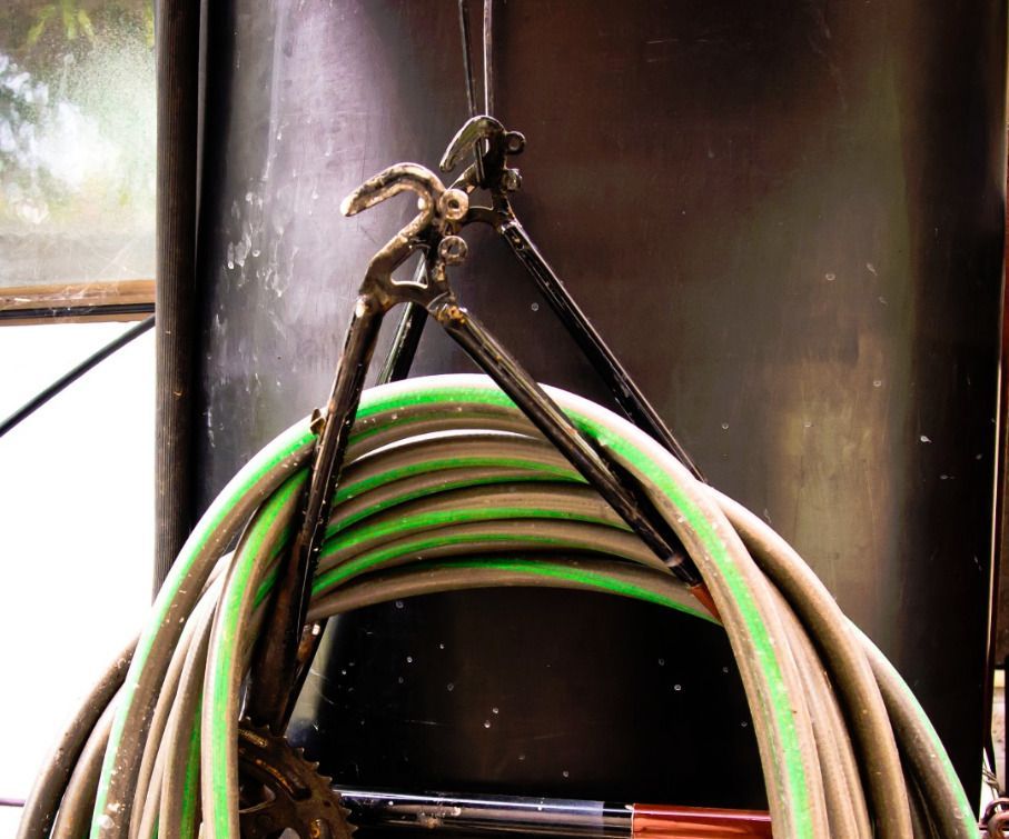Hose rack from bicycle frame
