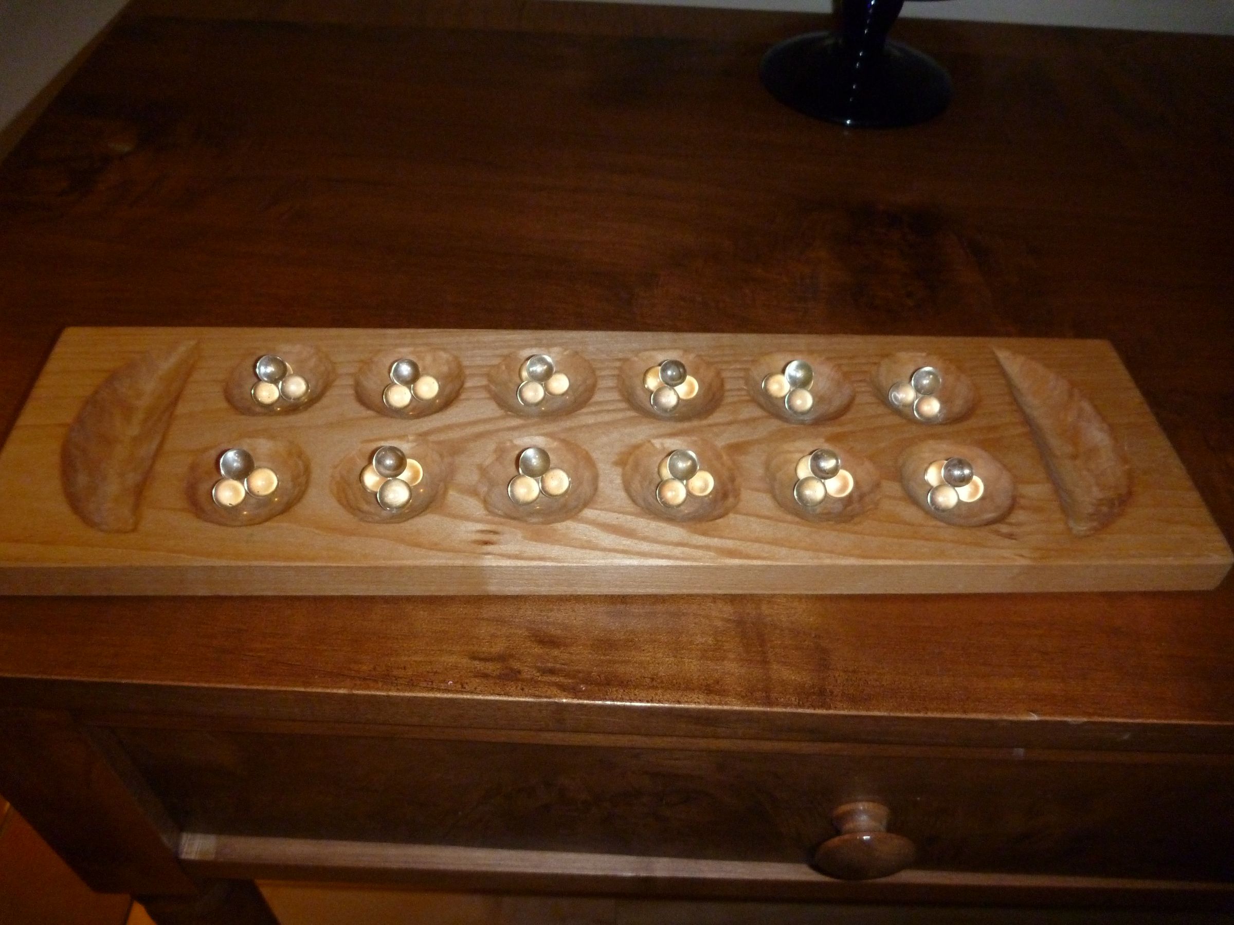 Mancala Board Wood Carving