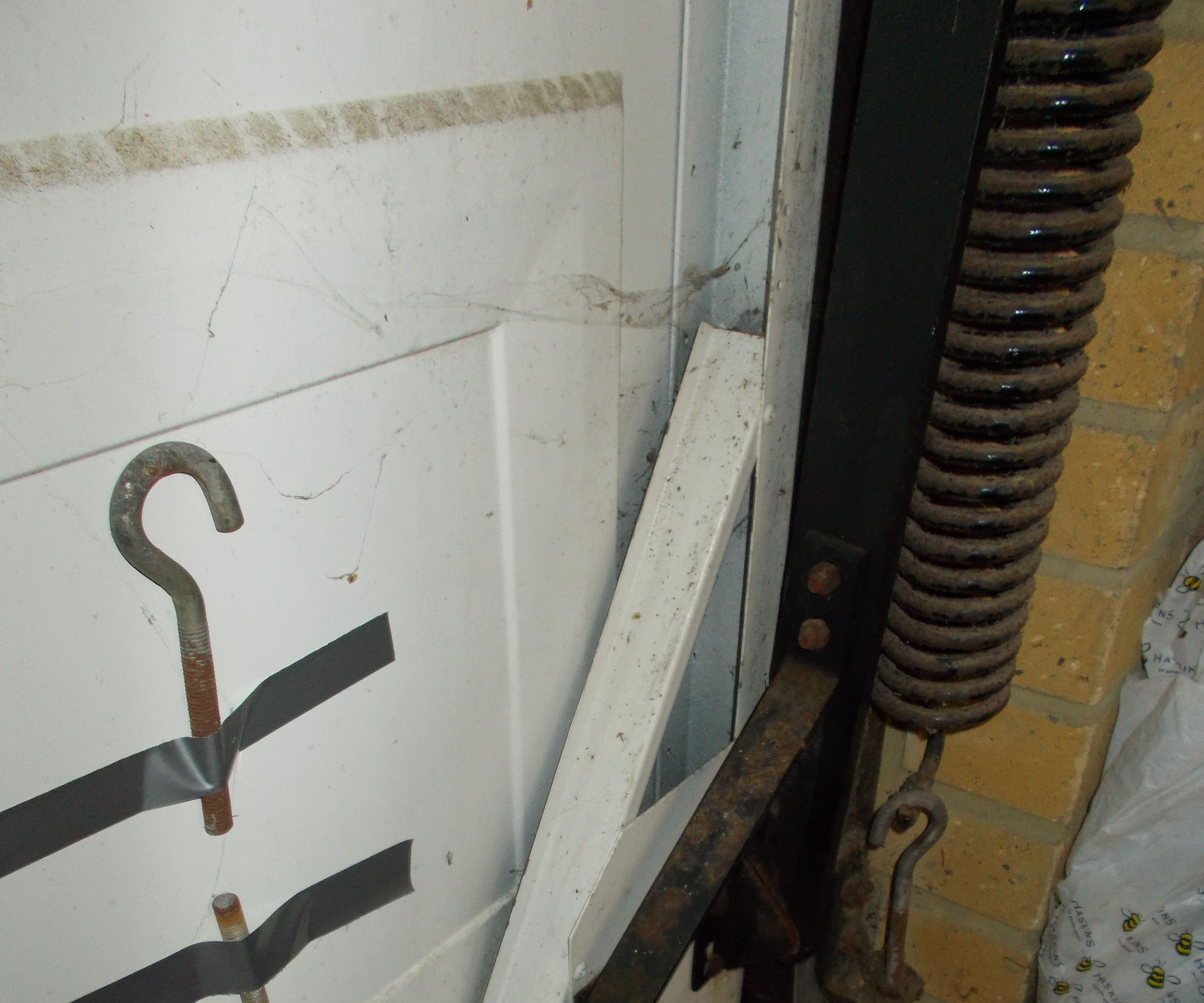 Fixing Garage Door Vertical Spring Mount