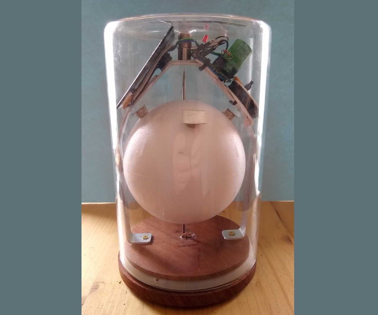 Continuously Rotating Sphere in a Glass Jar