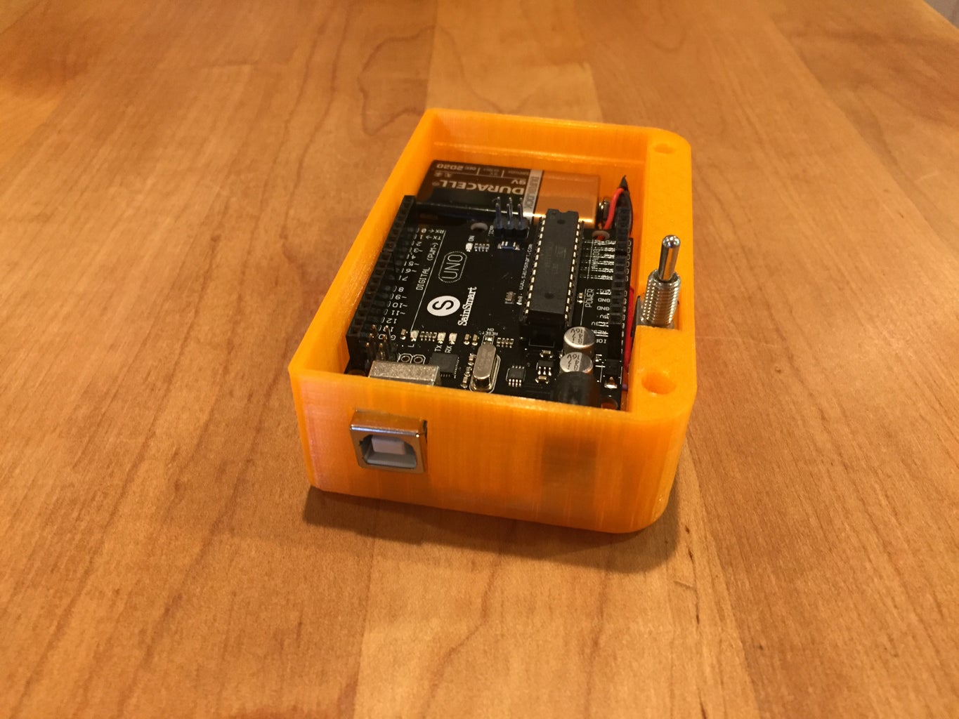 Insert the Arduino and Battery Into the Case