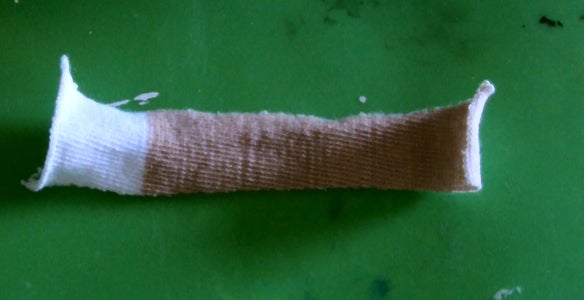 Cut Out the Arms and Mouth Pieces From Your Other Sock