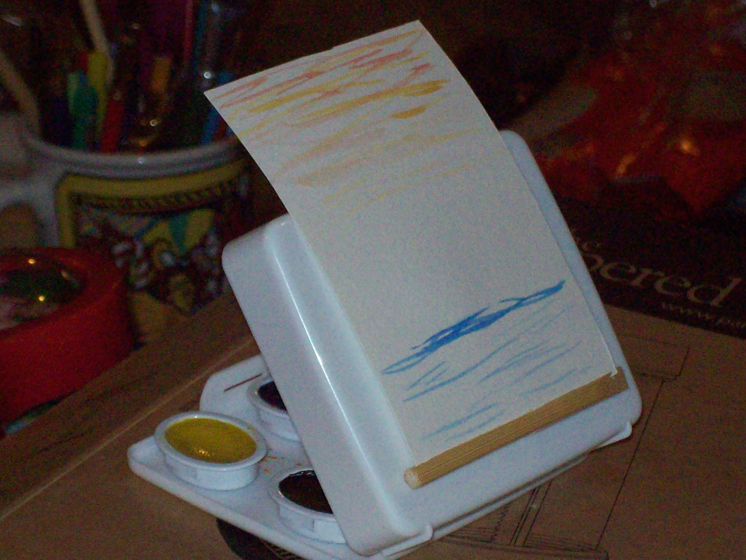 Pocket sized Water color kit made from plastic first aid kit with a brush that deassembles