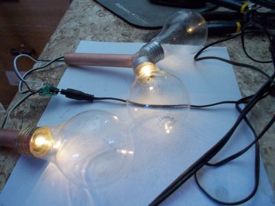 Glue the Light Bulbs to the Copper Pipes