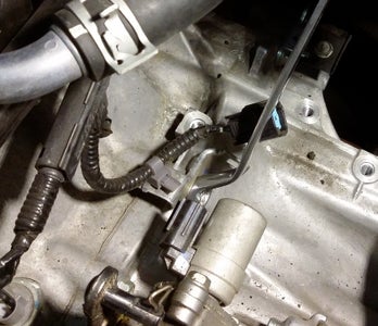 Disconnect the Shifter, Sensors, and Harness From Transmission