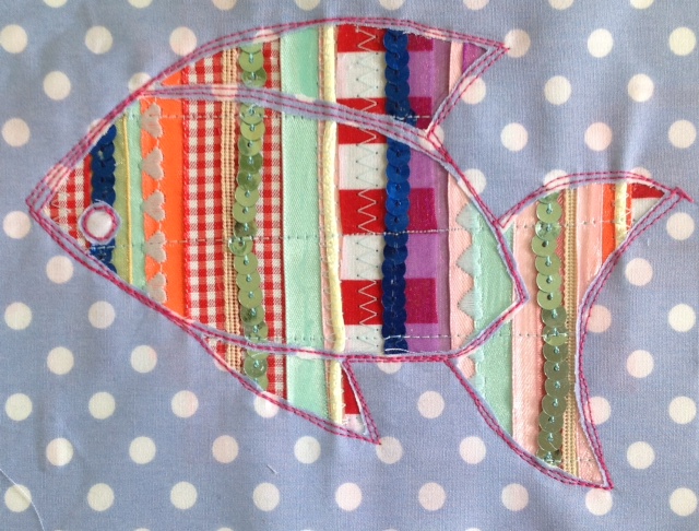 Reverse applique spangly fish picture.