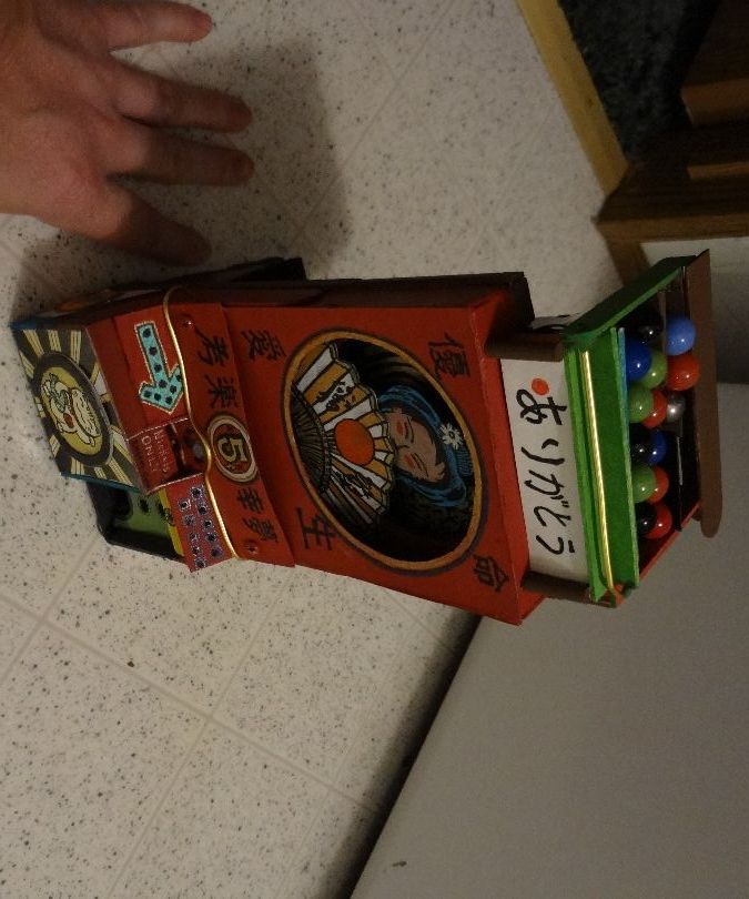 Oriental Themed Automata Coin Operated Marble Dispenser.