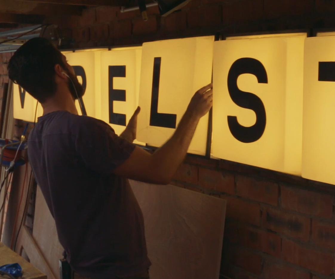 Fixing a Streetsign With My Name on It