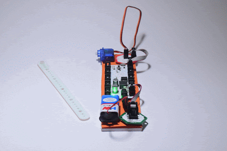 Connect One End of the Servo Horn Extender to the Servo and Attach the Paper Cup to the Other End of the Extender As Shown Below .