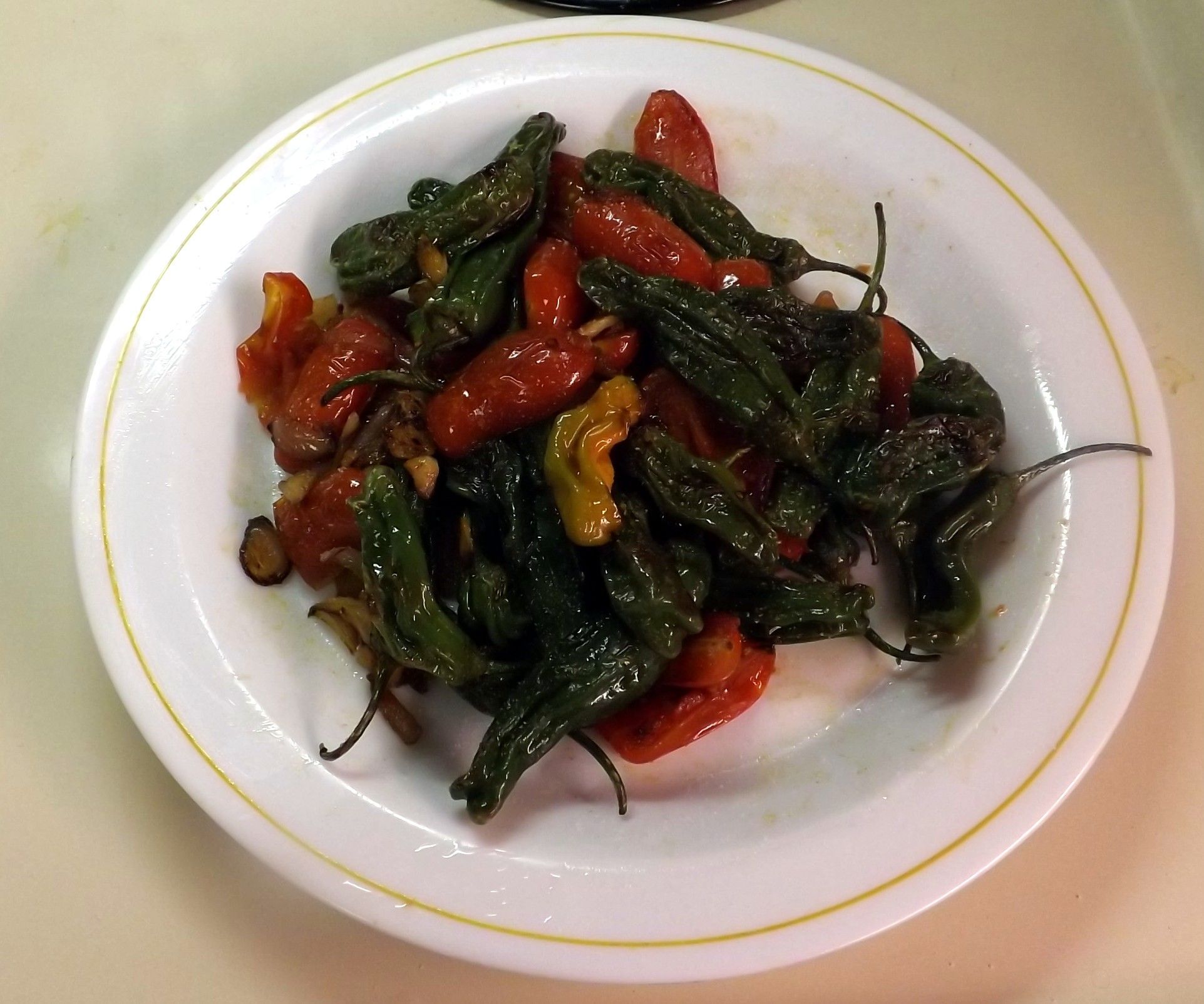 SAUTEED SHISHITO PEPPERS WITH MINI TOMATOES