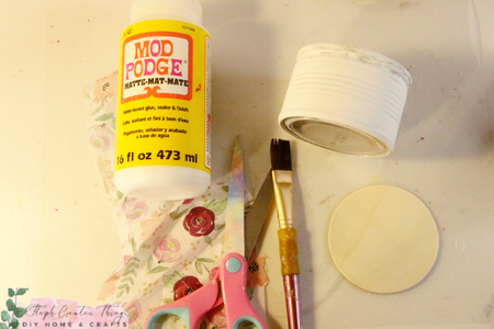 Adding Mod Podge and Floral Tissue Paper