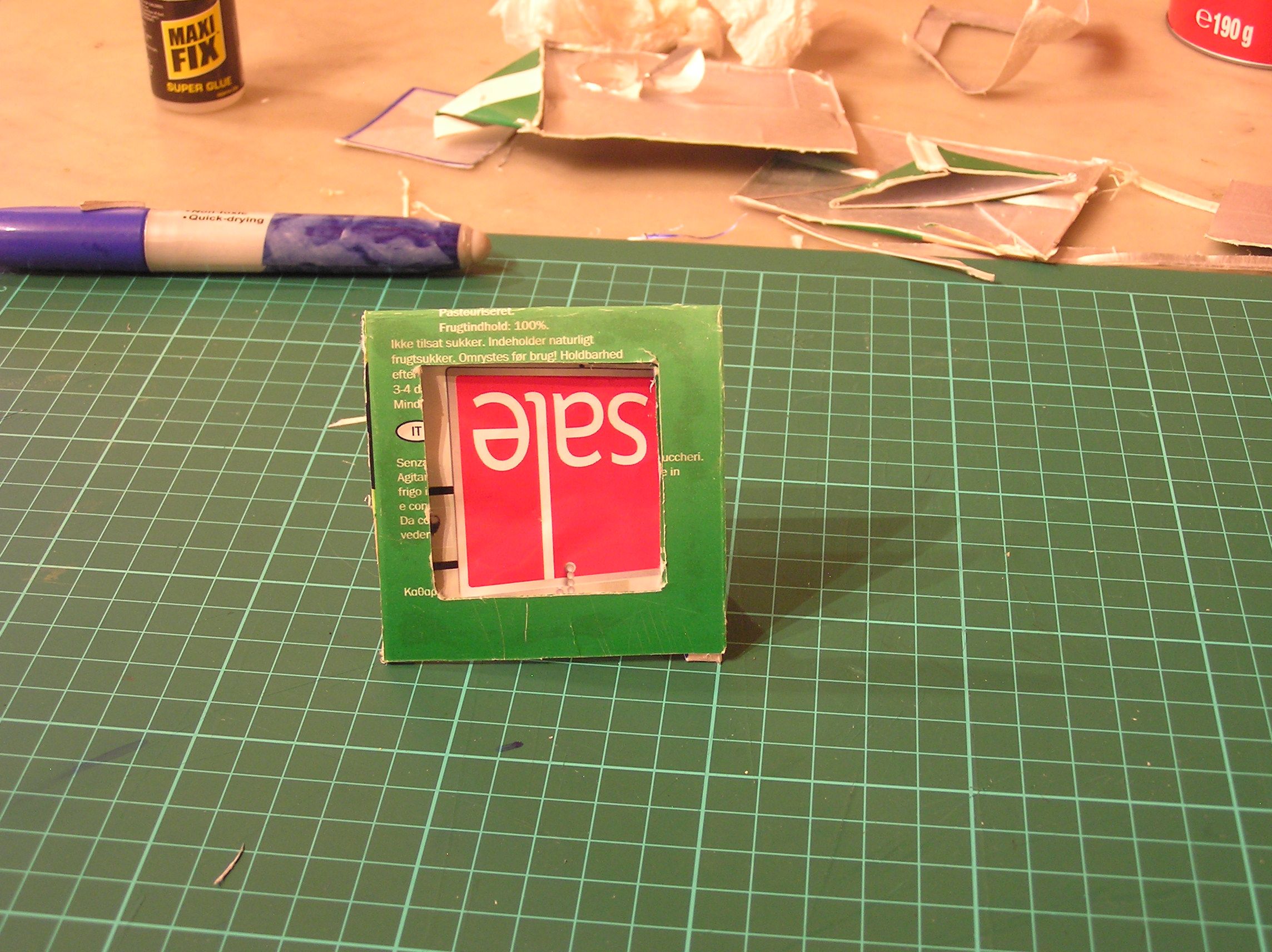 Upcycle a juice carton into a photo frame.