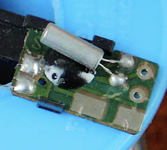 The Contact Closer to the Black Dot on the Circuit Board Is Negative, and the One Farther From the Edge of the Board Is Positive.