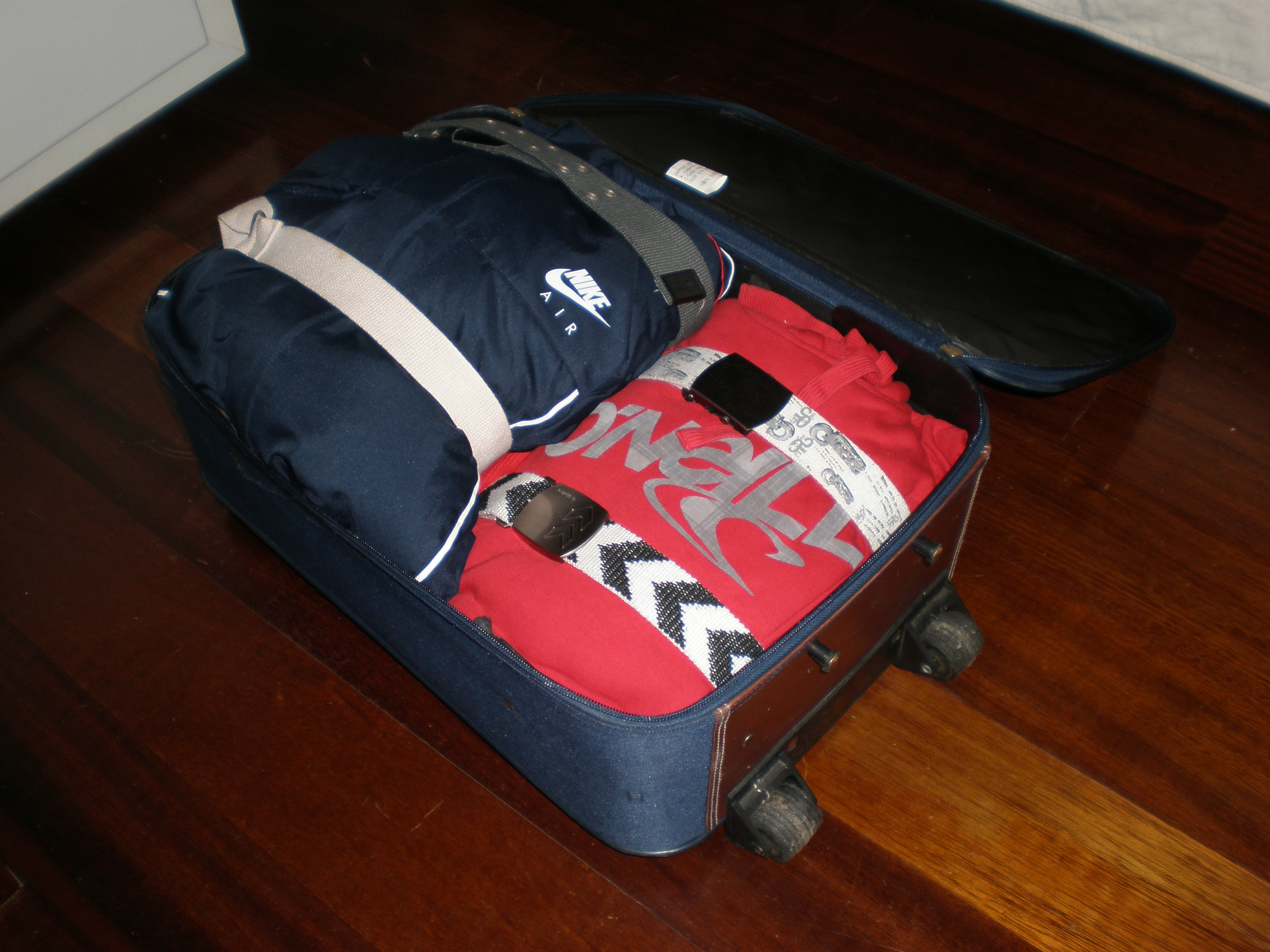 Pack a Suitcase Better Using Belts