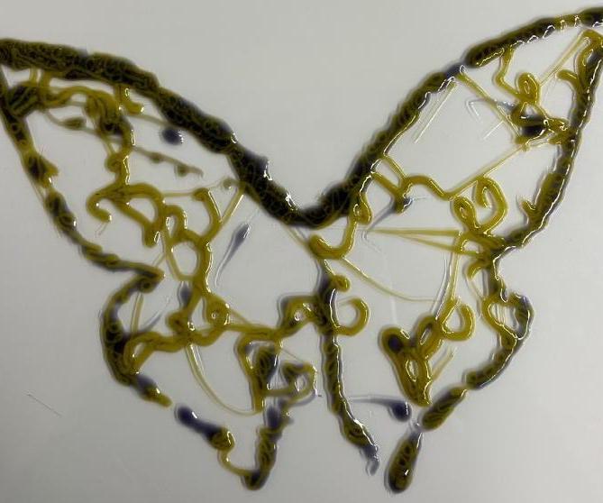 Silicone Butterflies From a Dispenser Mounted Robotic Arm