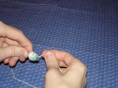 Wrap the String Around the Tube and Weight.