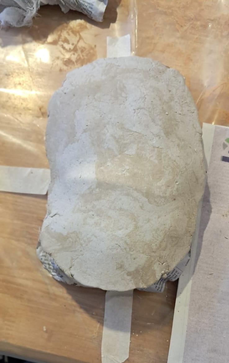 Spread the Clay Over the Newspaper Base !!