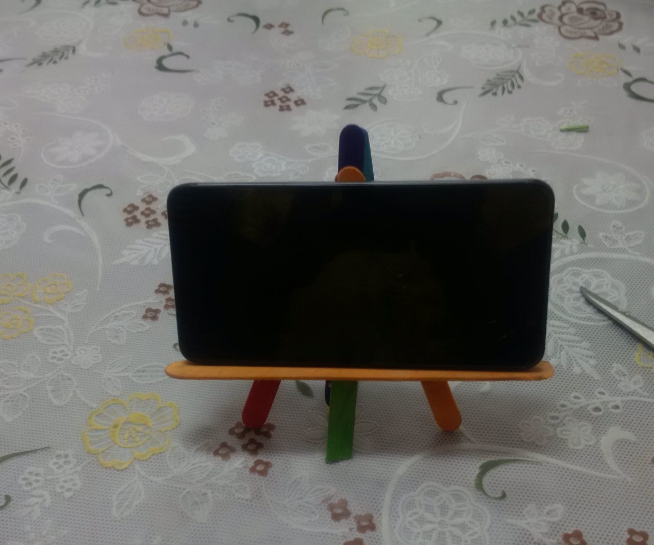Popsicle phone holder