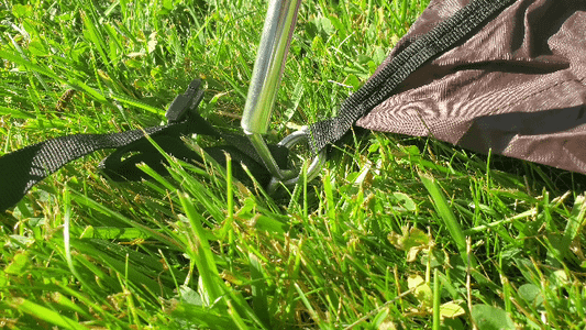 Place the First Pole Into the Pins at Opposite Corners, Bending the Pole As Needed