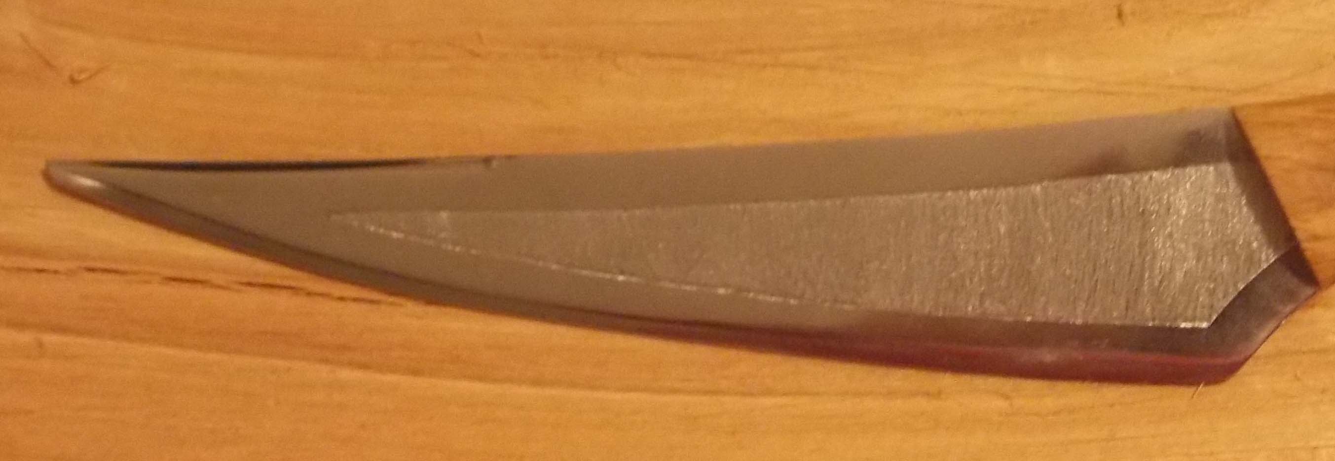 Hand engraving a knife blade