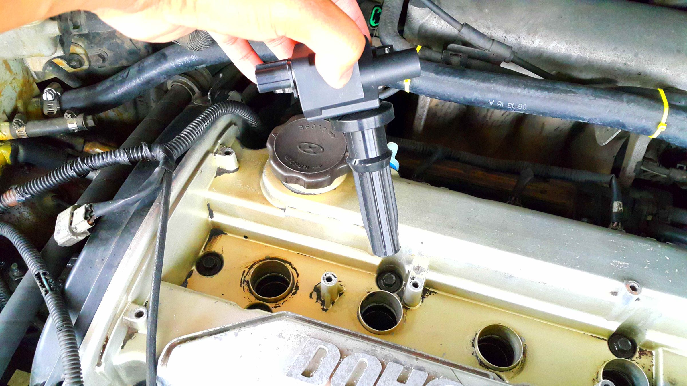 Replacing Coil Packs and Spark Plug Wires for Hyundai Trajet 2000. 3