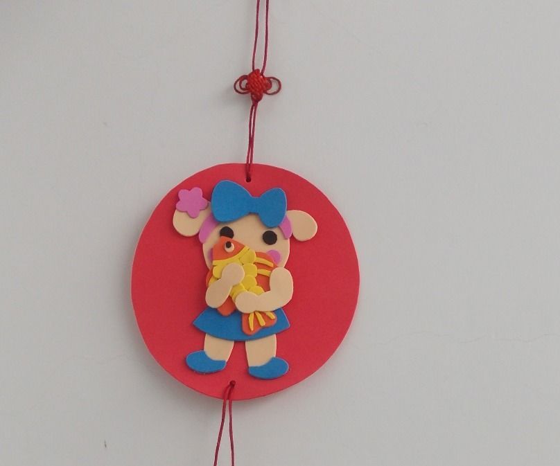 Miss La Sen Holding the Fish Decoration on Lunar New Year